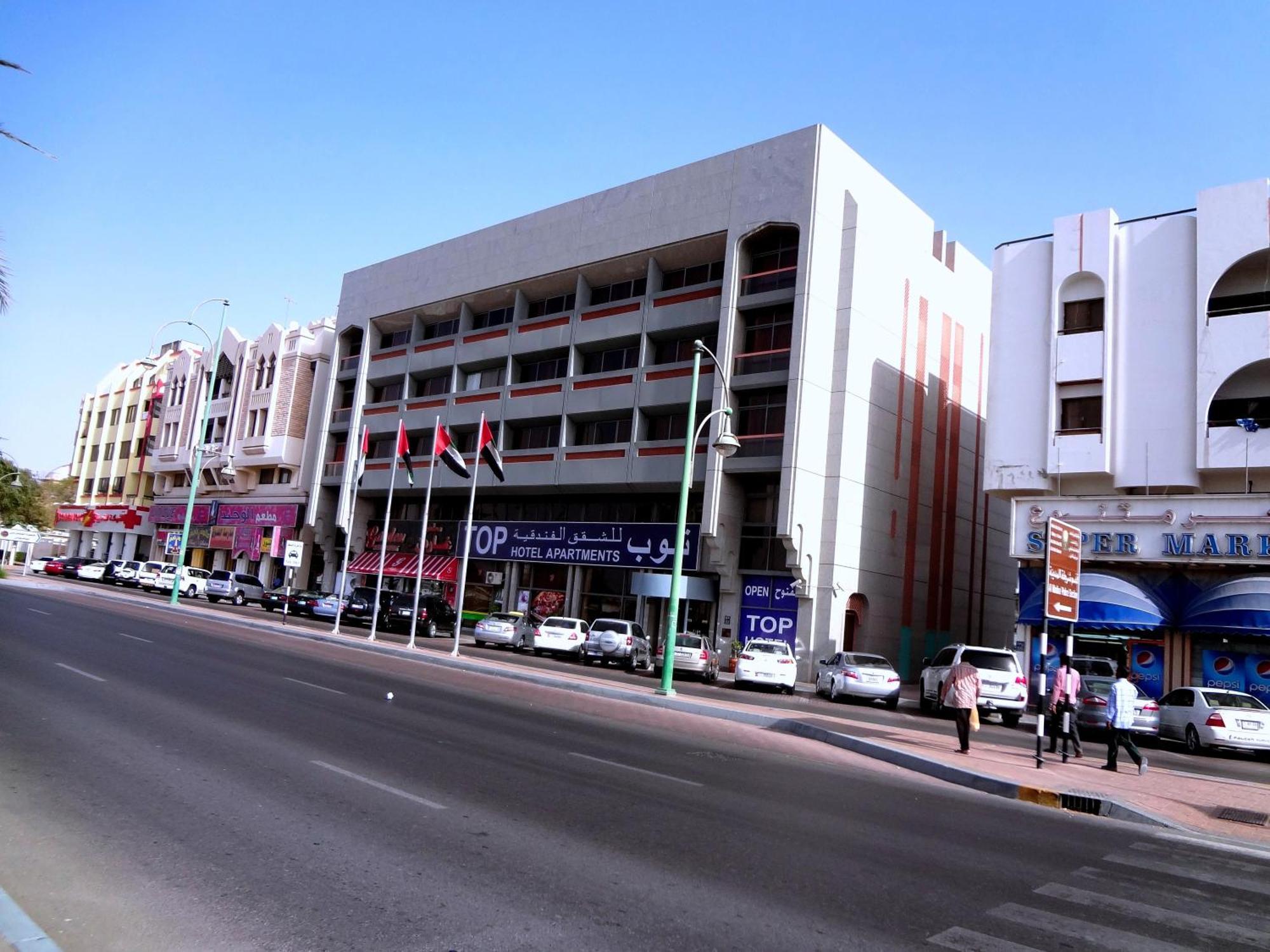 العين  توب للشقق الفندقية المظهر الخارجي الصورة